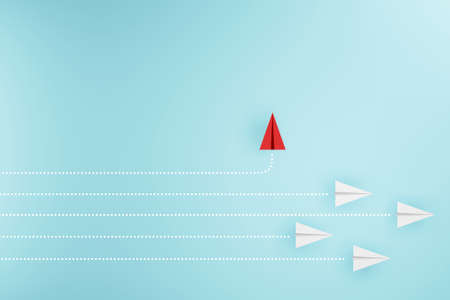 Group of paper plane in one direction and with one individual pointing in the different way....