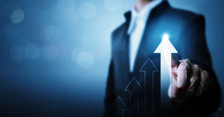 Business development to success and growing growth concept. Businessman pointing arrow graph corporate future growth planの写真素材