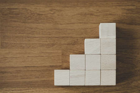 Group of wood block stacking as step staircase. Business concept for growth success processの写真素材
