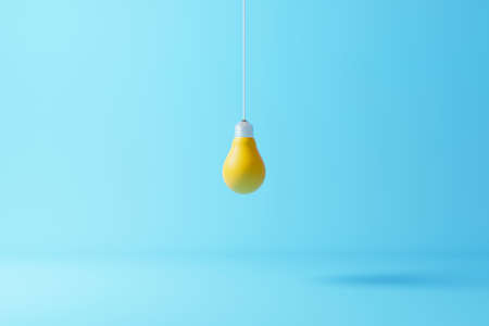 Hanging light bulb yellow standing on light blue background. Concept of creative idea and innovation. 3d render illustrationの写真素材