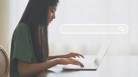 Women using computer laptop to find what they are interested in. Searching information data on internet networking conceptの写真素材