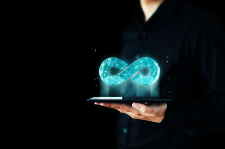 Concept save energy efficiency. Hand holding icon infinity signの写真素材