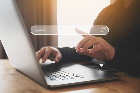 Man using computer laptop to find what they are interested in. Searching information data on internet networking conceptの写真素材