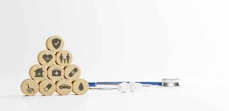 Health care medical insurance life, family, car travel and house concept. Wooden block stack with icon healthcare and stethoscope on white backgroundの写真素材