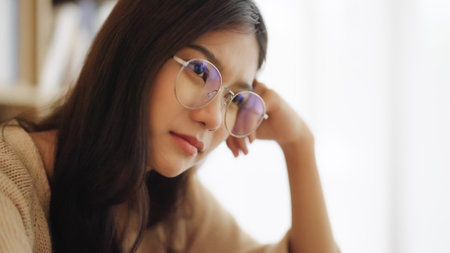 Young asian woman upset, frustrated by problem with work or relationships,  feeling despair and anxiety, loneliness, having psychological troubleの写真素材