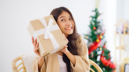Asian young woman opening a gift box. Happy new year, Thanksgivingの写真素材