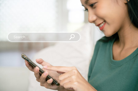 Women use smartphones to find what they are interested in. Searching information data on internet networking conceptの写真素材
