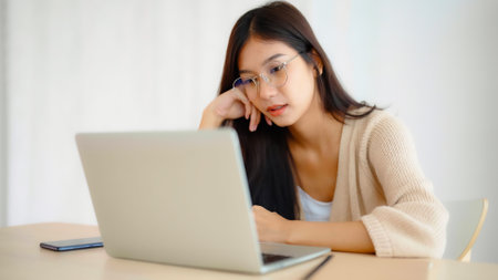 Young asian woman upset, frustrated by problem with work or relationships,  feeling despair and anxiety, loneliness, having psychological troubleの写真素材
