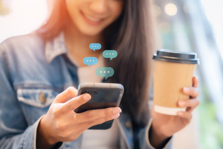 Hand of woman typing text on mobile smartphone. Online live chat chatting on application communication digital media website and social networkの写真素材