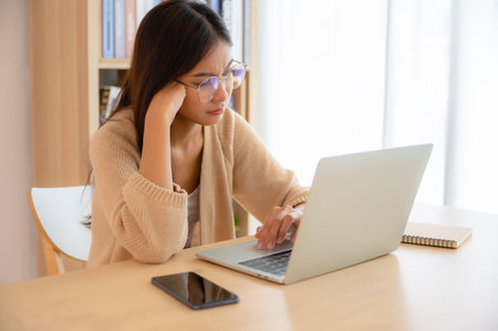 Young asian woman upset, frustrated by problem with work or relationships,  feeling despair and anxiety, loneliness, having psychological troubleの写真素材