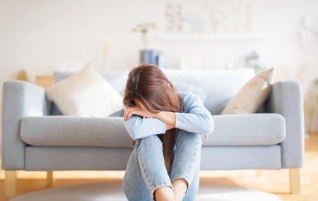 Young asian woman upset , sadness and frustrated by problem with work or relationships. Feeling despair and anxiety, loneliness, having psychological troubleの写真素材