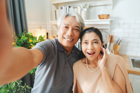 Happy, love and a senior Asian couple with a selfie for a memory. Smile, affection and an elderly man taking a photo with a woman for memories, friendship or happinessの写真素材