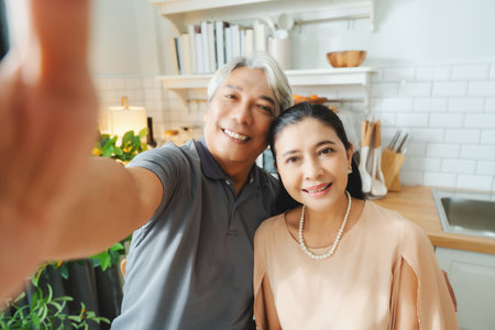Happy, love and a senior Asian couple with a selfie for a memory. Smile, affection and an elderly man taking a photo with a woman for memories, friendship or happinessの写真素材