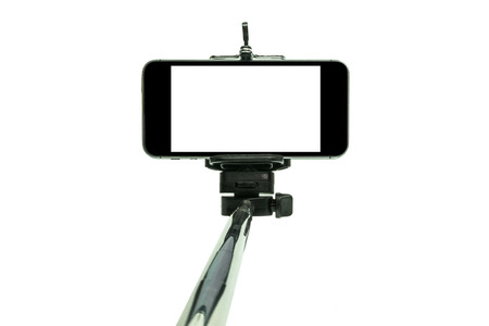 Smartphone on a selfie stick shot in studioの写真素材