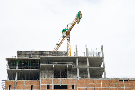 Crane and building construction site
