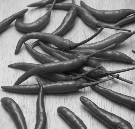 Red hot chili peppers on woodenの写真素材