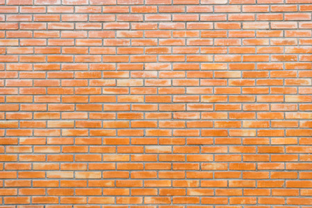 Red brick stone wall seamless background and texture