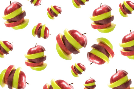 Many sliced red and green apple isolatedの写真素材