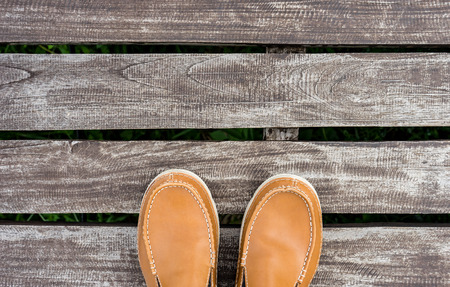 men's leather shoes on old wood backgroundの写真素材