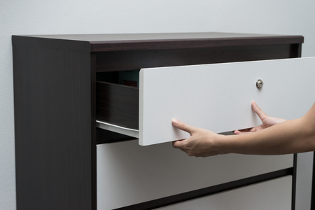 Woman hand open drawer ,wardrobeの写真素材