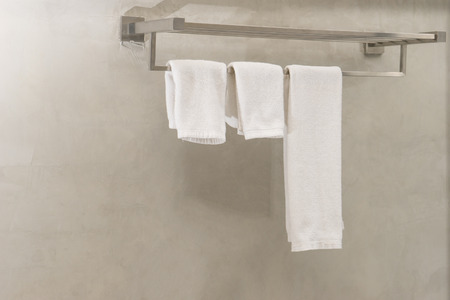 Clean white towel on a hanger for two peopleの写真素材