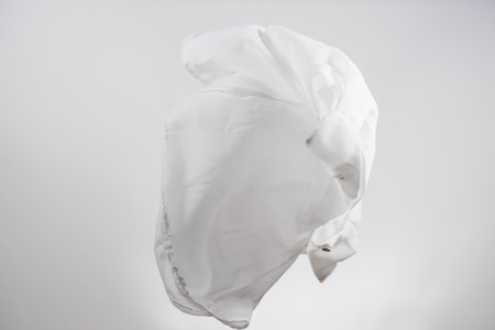 White shirts fabric flying, studio shot , scarf motionの写真素材