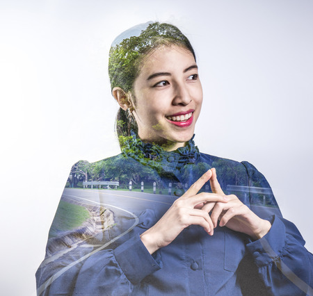 Double exposure adult young pretty business woman and roadの写真素材