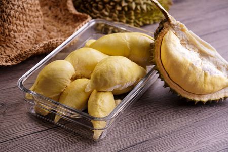 Ripe durian on wooden tableの写真素材
