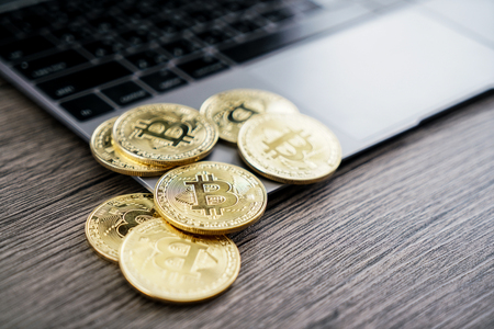 Golden Bitcoin money on computer.の写真素材