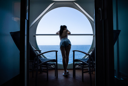 woman relaxing on Cruise ship enjoying ocean view from  balconyの写真素材