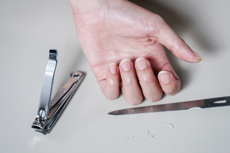 Closeup Woman prepare Cutting her Nailsの写真素材