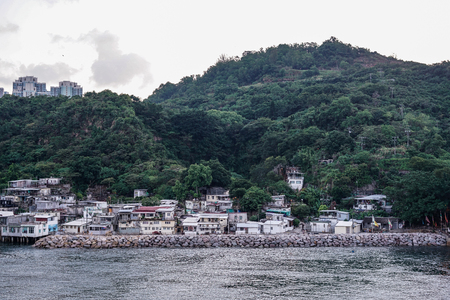 small fisherman village with green mountainの写真素材