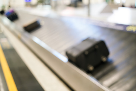 Blurred photo of conveyor belts for transport luggage.の写真素材