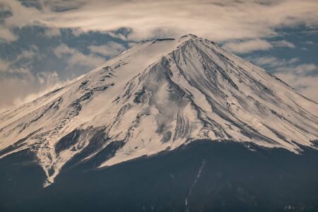 Close up top of Fuji mountain with snow cover on the top with could, fujisanの写真素材