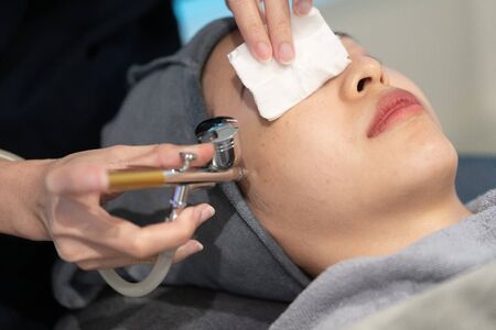 Rejuvenating facial gas treatment. Face peeling procedure in a beauty clinic.