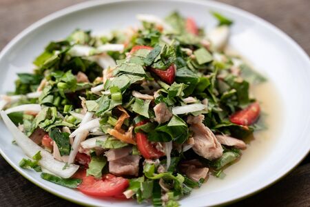 Spicy tuna salad with green tea leaves.の写真素材