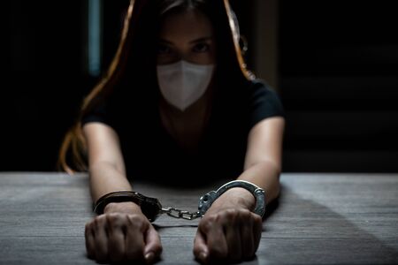 Handcuffed on a prisoner, Woman prisoners were handcuff in the dark prison.