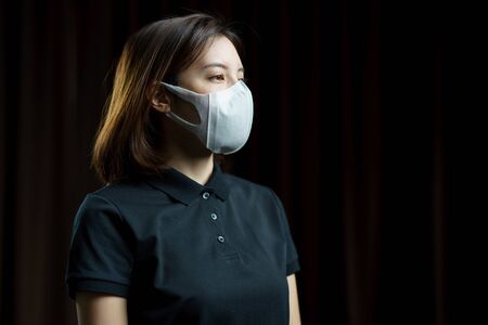 Woman wearing the N95 Respiratory protection mask.の写真素材