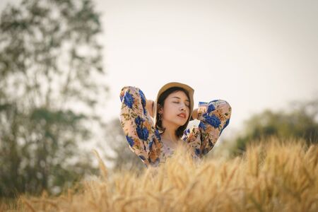 Woman enjoying nature in a farm field