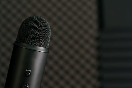 Close-up of professional condenser microphone on a black background.の写真素材