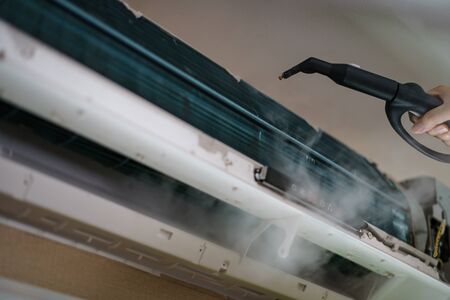 technician open for cleaning air conditioner indoors.の写真素材