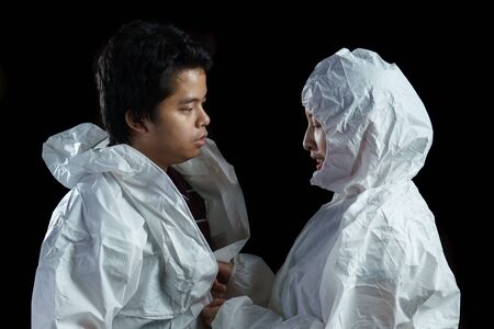 Doctor suit up ppe suit , Corona virus, Covid-19 virus outbreak concept. black background