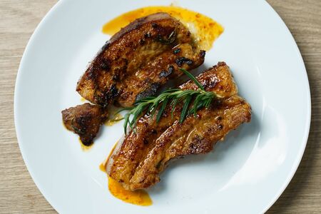 Pork juicy steak grill with vegetables and spices.の写真素材