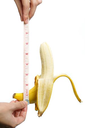 Banana and measuring tape Isolated on white background. isolatedの写真素材