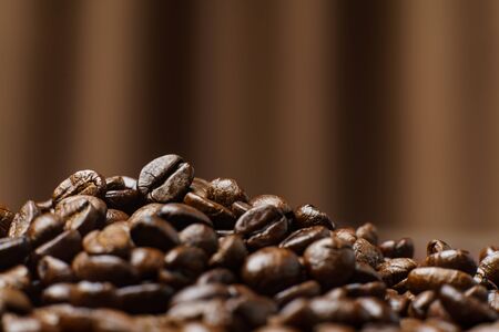 Roasted Coffee Beans texture on Curtain background, macro.