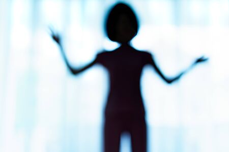 Blurred silhouette of human body look like alien.の写真素材