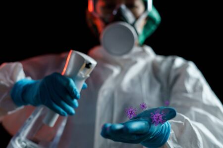 Hand using sanitizer spray, alcohol spraying disinfectant to stop spreading  Virus, bacteria or COVID-19. PPE suitの写真素材