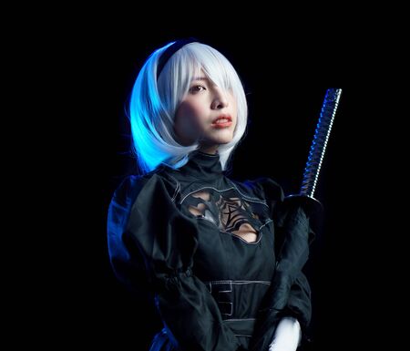 Japan anime cosplay. portrait of woman in black dress with white hair.の写真素材