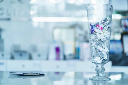 Group of plastic syringe for filler injection  on glass vase. filler needle.の写真素材