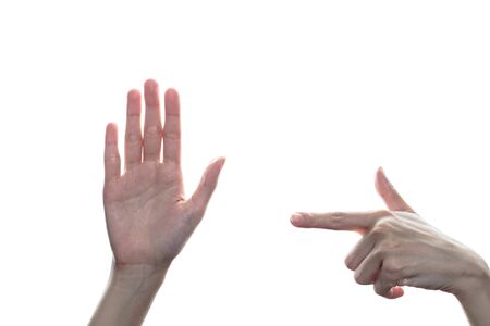 Woman pointing finger to another hand with sign stop on white isolated background.